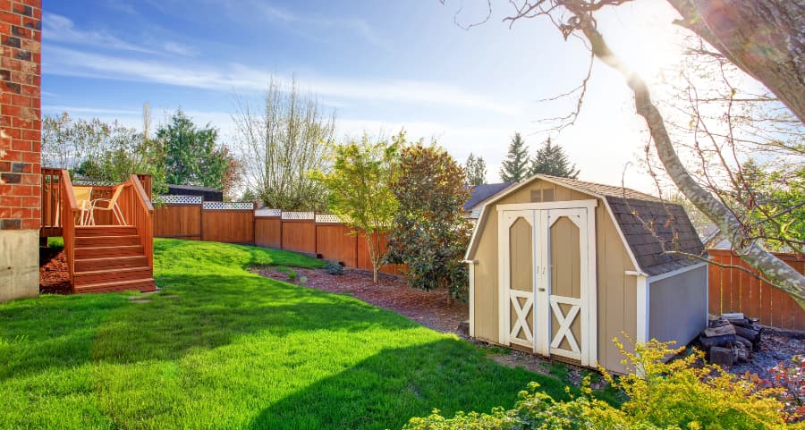 Fenced backyard with storage shed in Bowling Green